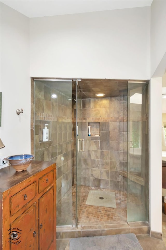 bathroom with vanity and an enclosed shower