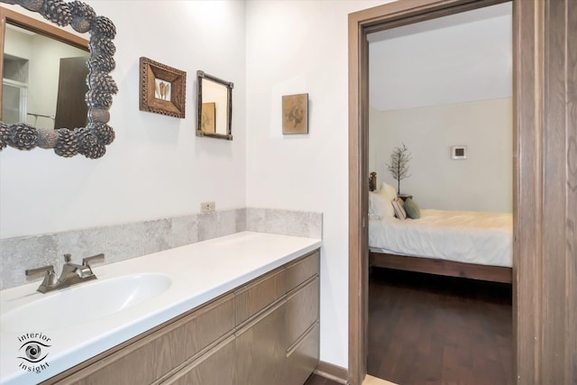 bathroom with vanity and hardwood / wood-style flooring