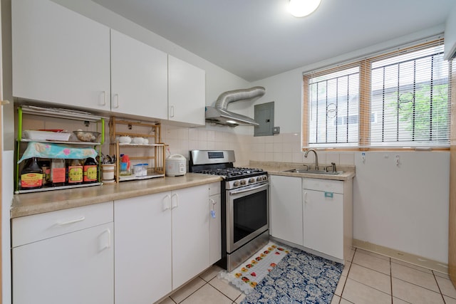 4629 S Laflin St, Chicago, IL 60609 - kitchen featuring white cabinets, stainless steel gas range, light countertops, and a sink
