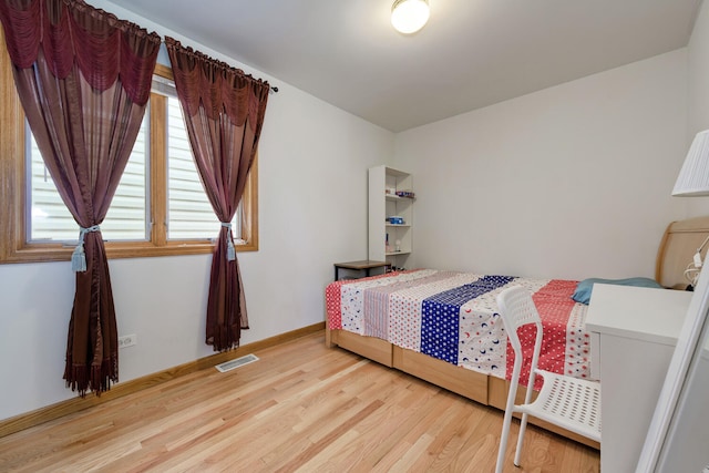 bedroom with light wood-type flooring