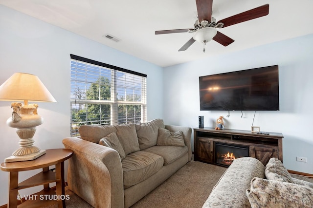 living room with carpet and ceiling fan