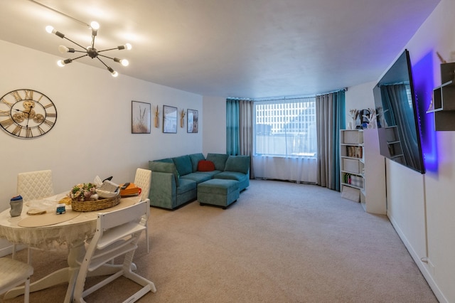 living room with carpet flooring and an inviting chandelier