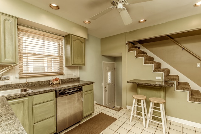 kitchen with tasteful backsplash, sink, dishwasher, ceiling fan, and light tile patterned floors