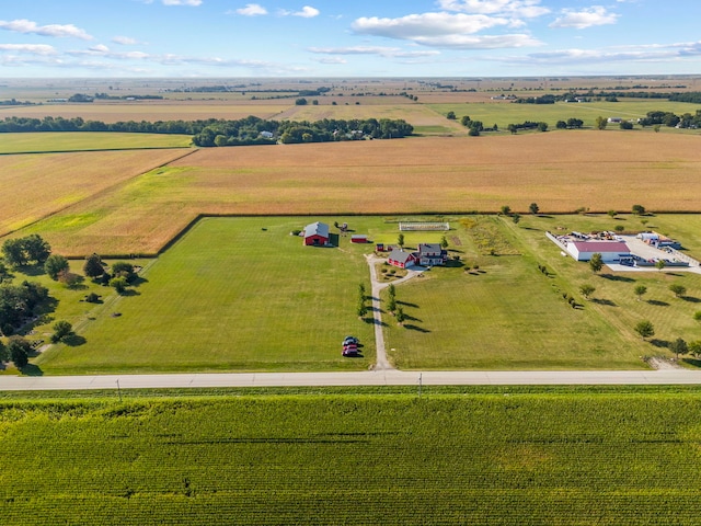 birds eye view of property with a rural view