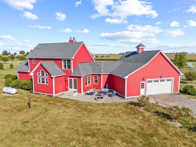 view of front of home featuring a garage, entry steps, roof with shingles, and a front lawn