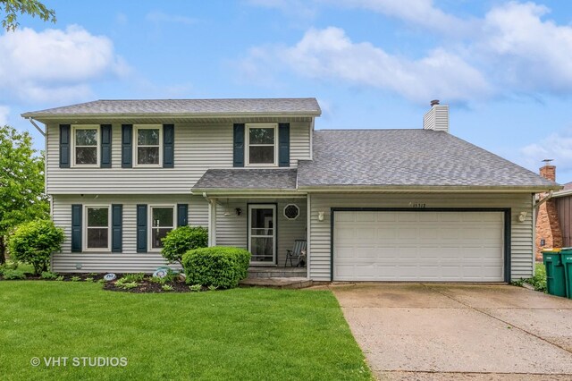 15312 Sunshine Cir, Plainfield, IL 60544 - view of front of home with an attached garage, a front yard, concrete driveway, a chimney, and roof with shingles