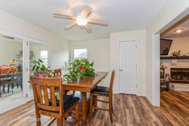 15312 Sunshine Cir, Plainfield, IL 60544 - dining area featuring wood finished floors, ceiling fan, and a brick fireplace