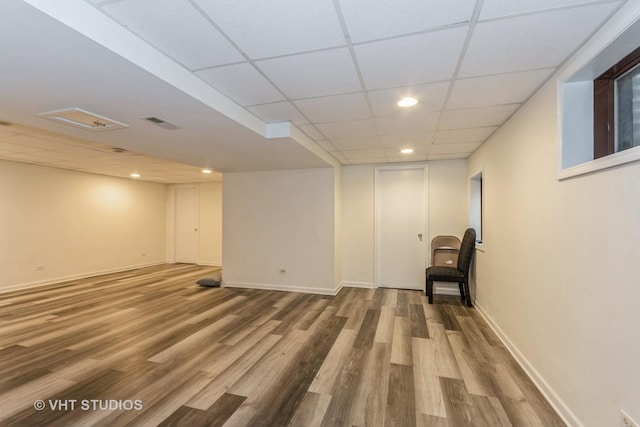 15312 Sunshine Cir, Plainfield, IL 60544 - below grade area with recessed lighting, a drop ceiling, wood finished floors, and baseboards
