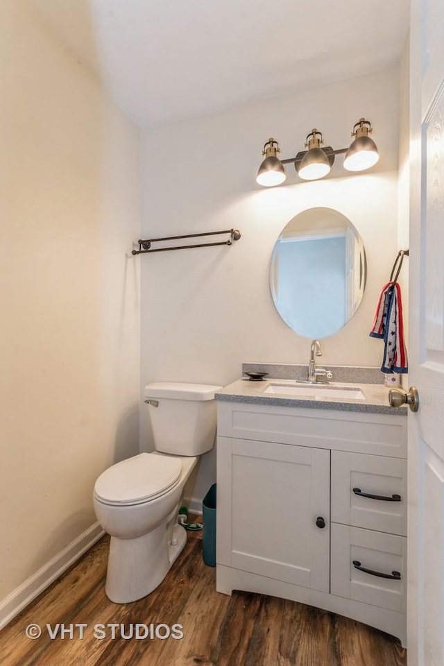 15312 Sunshine Cir, Plainfield, IL 60544 - bathroom featuring vanity, wood finished floors, toilet, and baseboards