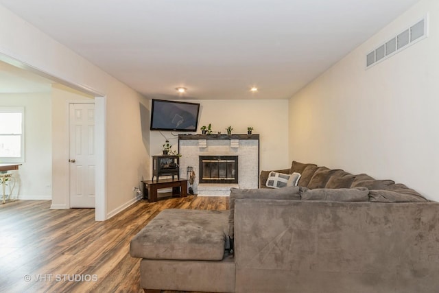 15312 Sunshine Cir, Plainfield, IL 60544 - living room featuring wood finished floors, a glass covered fireplace, recessed lighting, and baseboards