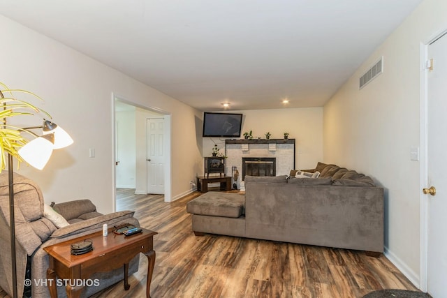 15312 Sunshine Cir, Plainfield, IL 60544 - living room featuring wood finished floors, a glass covered fireplace, baseboards, and recessed lighting