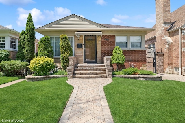 6144 N Keystone Ave, Chicago, IL 60646 - bungalow featuring brick siding, a shingled roof, and a front yard