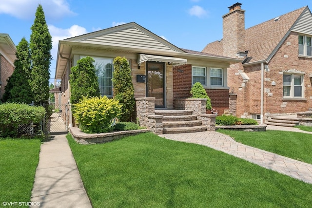 6144 N Keystone Ave, Chicago, IL 60646 - view of front of property with brick siding, a chimney, a front lawn, and a gate