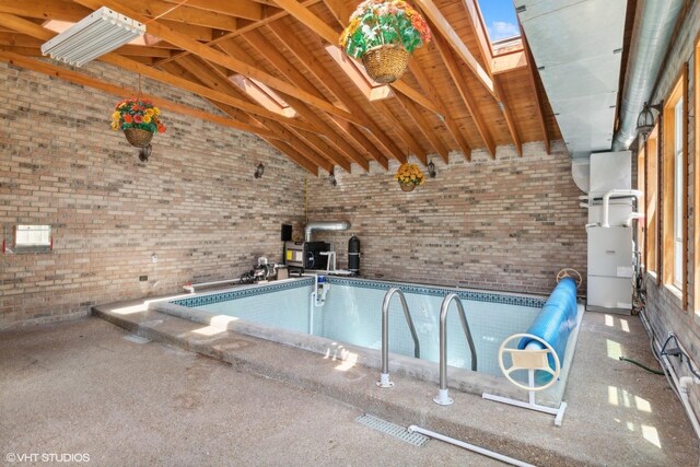 view of swimming pool with a skylight