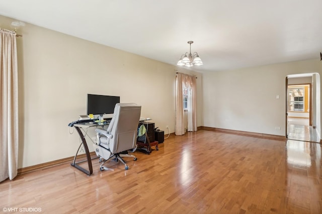 6144 N Keystone Ave, Chicago, IL 60646 - office with an inviting chandelier, light wood-style flooring, and baseboards