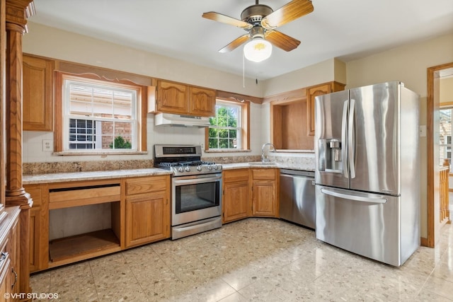 6144 N Keystone Ave, Chicago, IL 60646 - kitchen featuring a sink, ceiling fan, stainless steel appliances, under cabinet range hood, and brown cabinets