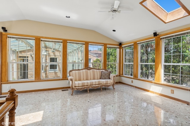 unfurnished sunroom with ceiling fan and lofted ceiling with skylight