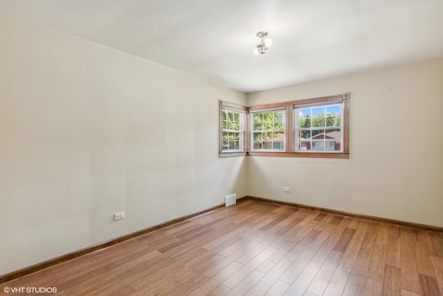 6144 N Keystone Ave, Chicago, IL 60646 - spare room with visible vents, baseboards, and light wood-type flooring