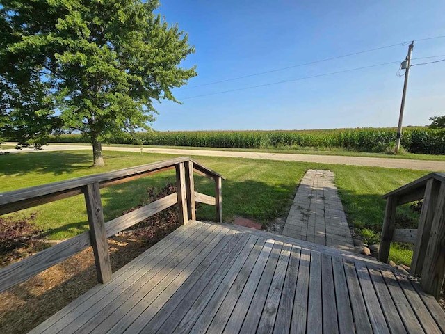 wooden terrace with a yard