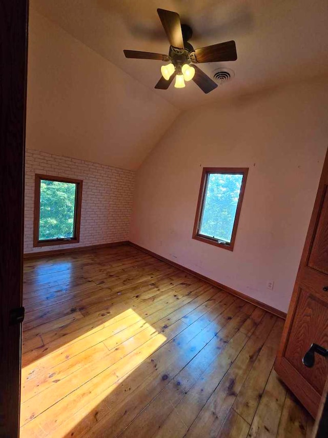 additional living space with ceiling fan, lofted ceiling, and light hardwood / wood-style floors