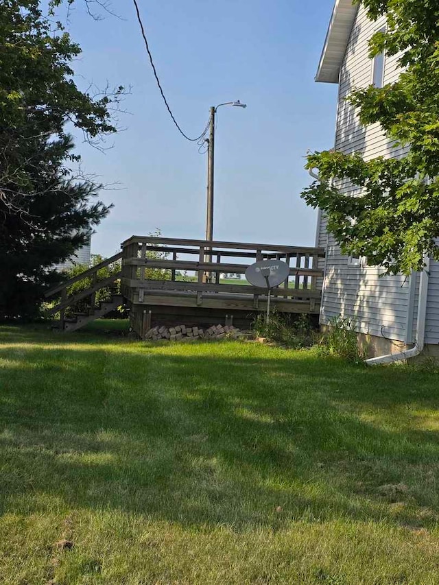 view of yard with a wooden deck