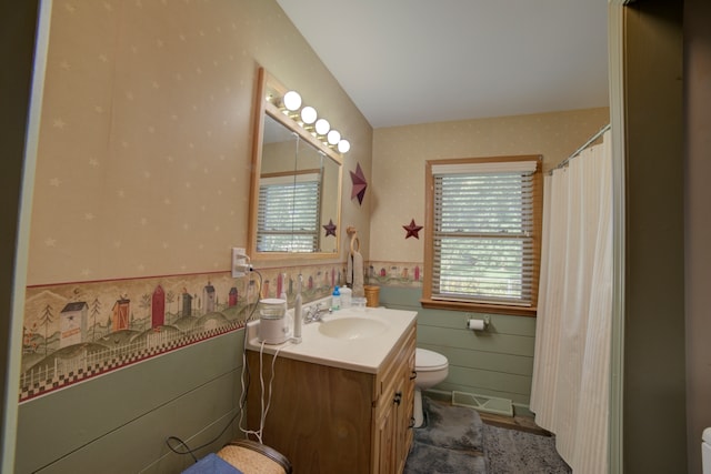 bathroom featuring vanity and toilet