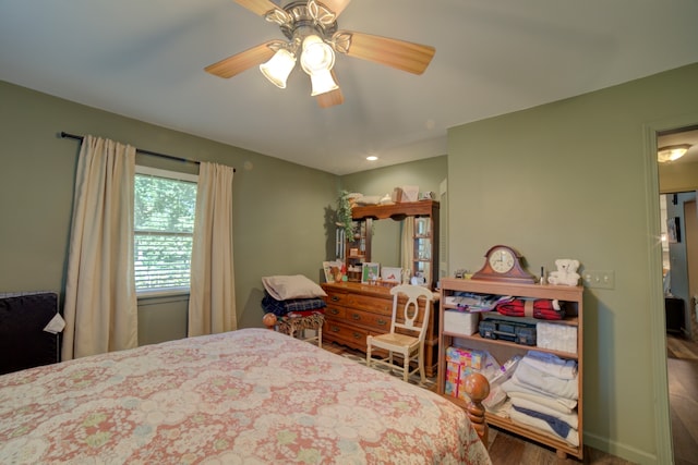 bedroom featuring ceiling fan and hardwood / wood-style flooring