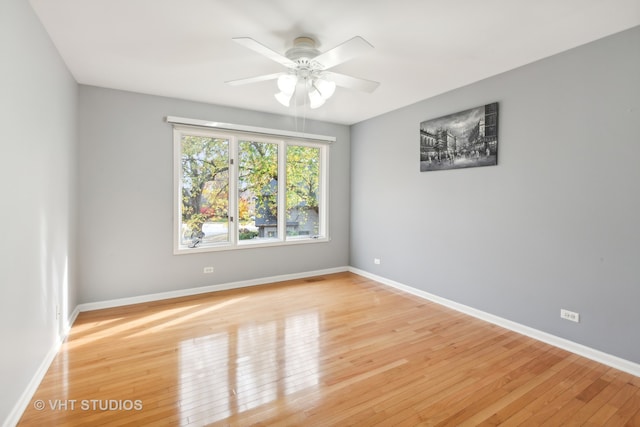 spare room with light hardwood / wood-style floors and ceiling fan