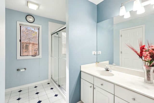 bathroom featuring vanity and an enclosed shower