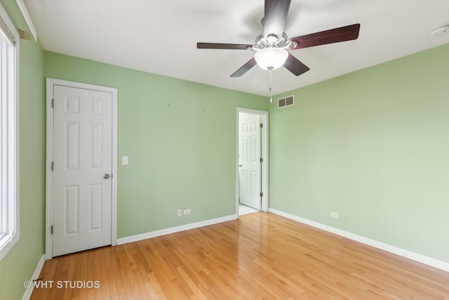 unfurnished bedroom with light hardwood / wood-style floors and ceiling fan