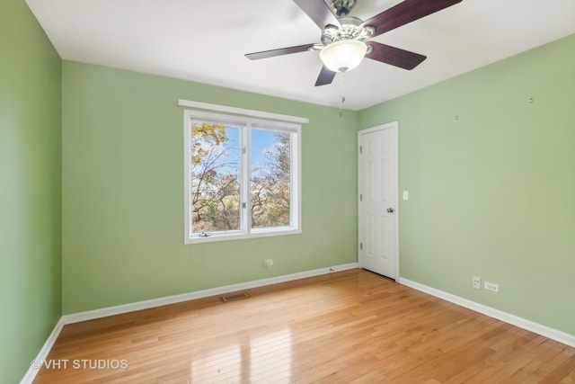 empty room featuring light hardwood / wood-style floors and ceiling fan