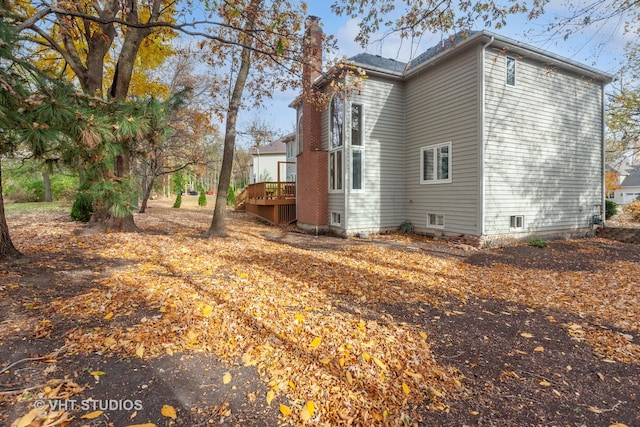 view of side of property featuring a deck