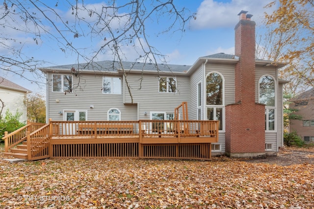 rear view of house featuring a deck