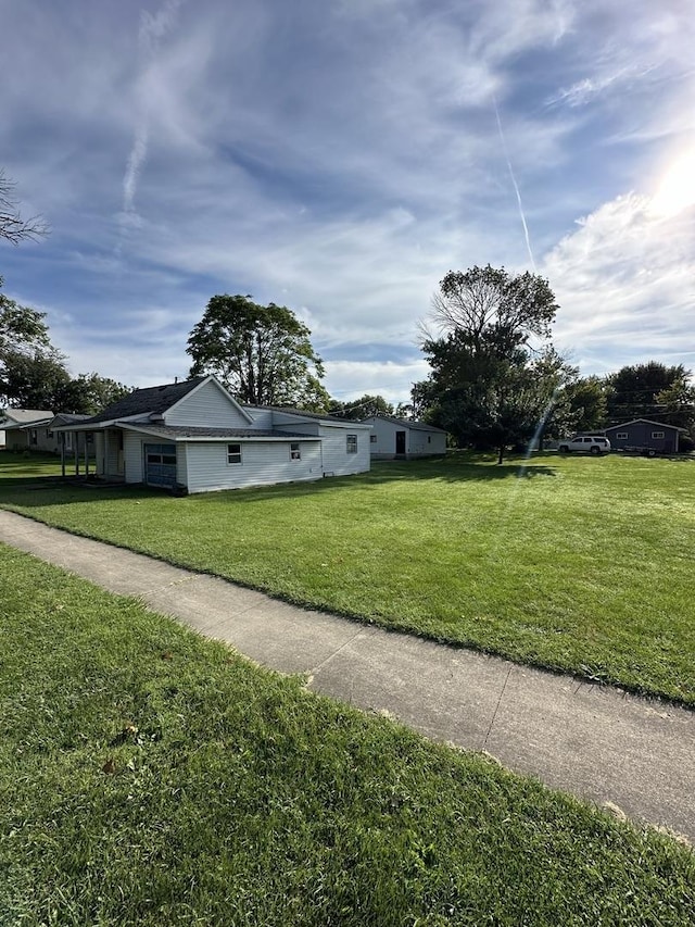 view of side of property with a yard