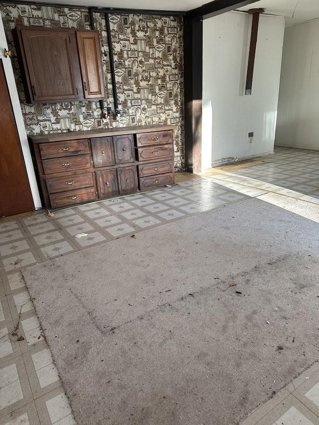 bathroom with tile patterned floors and vanity