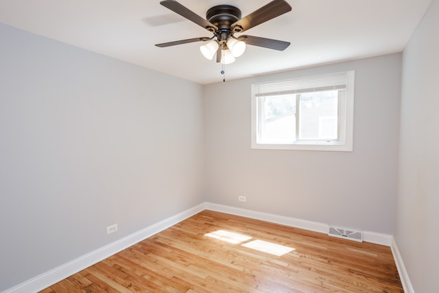 empty room with light hardwood / wood-style flooring and ceiling fan