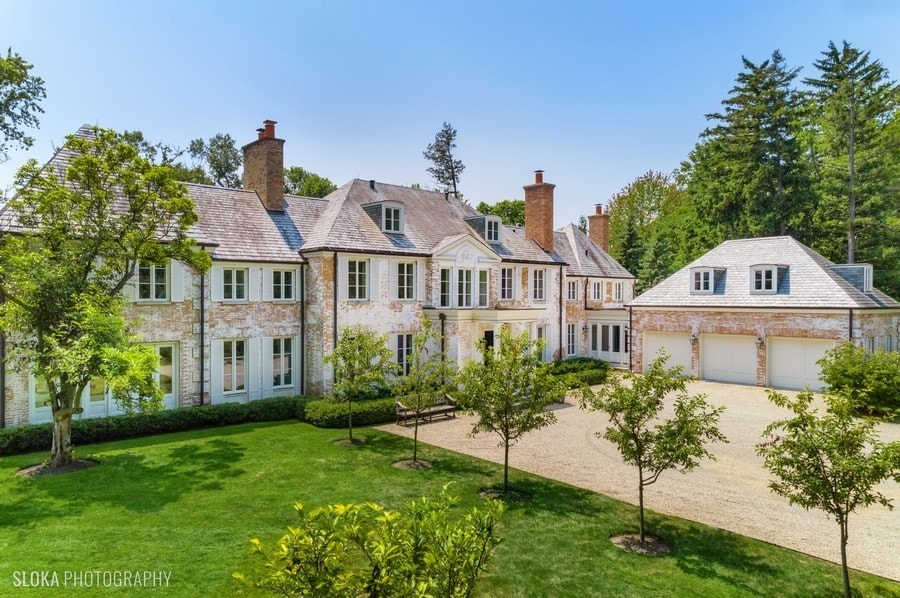 view of front of house with a front yard and a garage