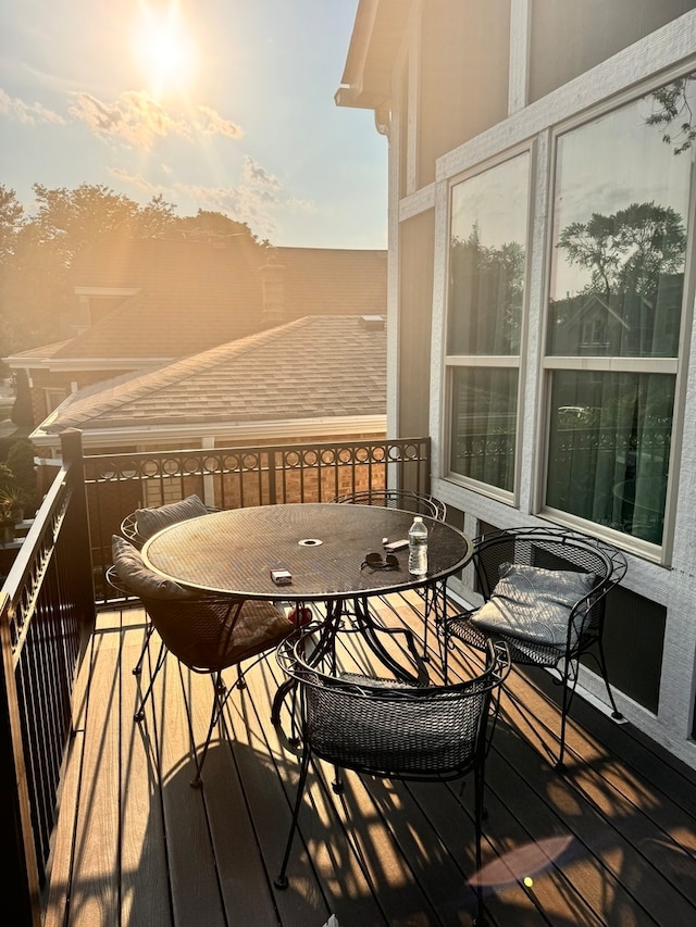 view of balcony at dusk