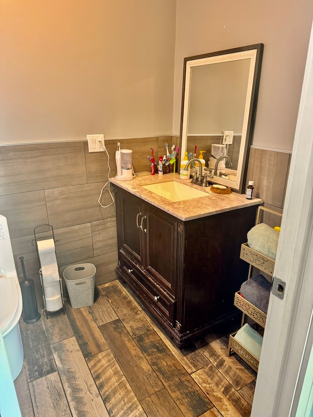 bathroom with tile walls and vanity