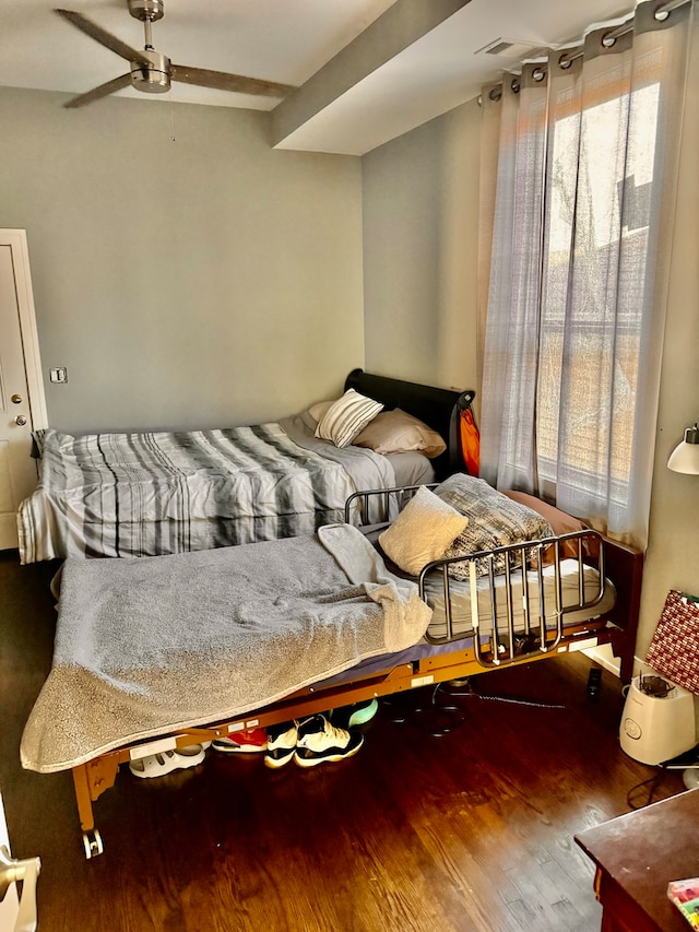 bedroom with ceiling fan and wood-type flooring