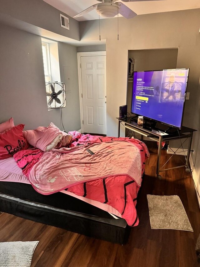 bedroom featuring ceiling fan and wood-type flooring