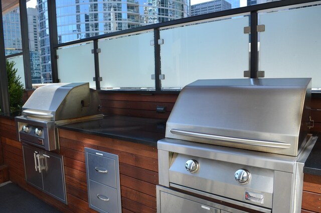 view of patio / terrace featuring area for grilling and a grill