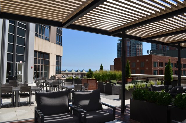 view of patio featuring an outdoor living space and a pergola