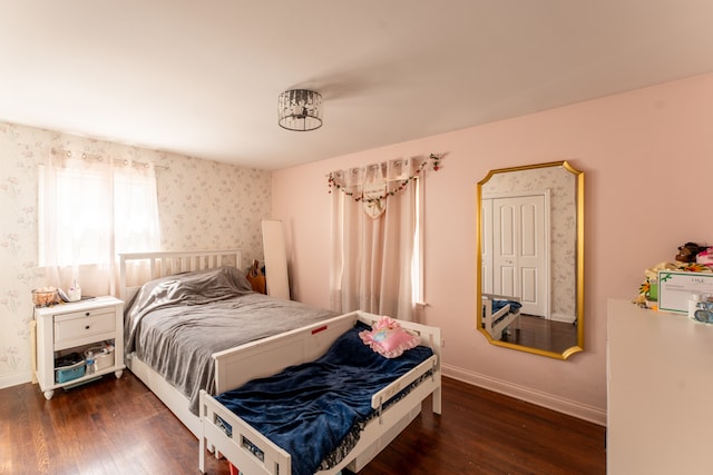 bedroom featuring dark hardwood / wood-style flooring