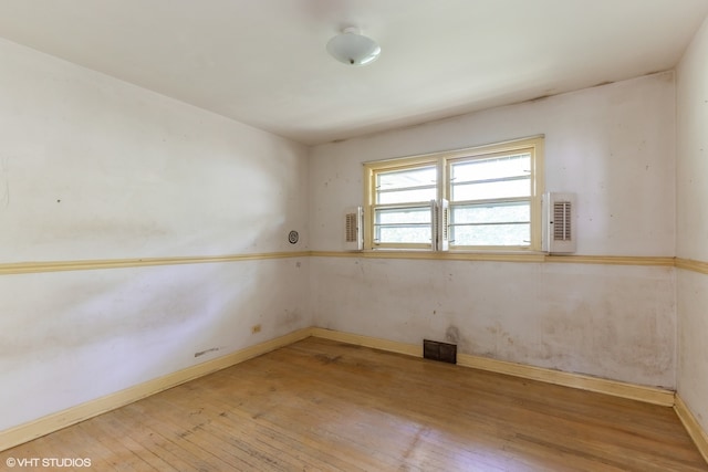 unfurnished room with light hardwood / wood-style flooring