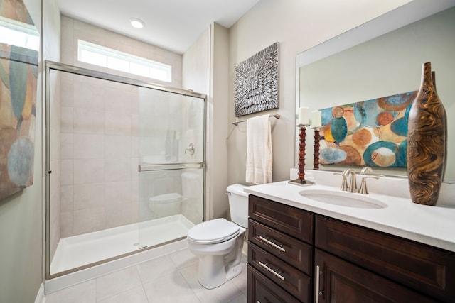 bathroom featuring a shower with door, toilet, tile patterned floors, and vanity