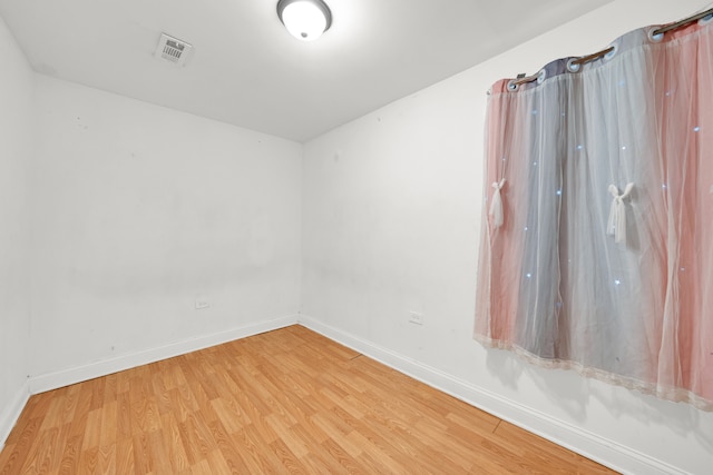 spare room featuring light wood-type flooring