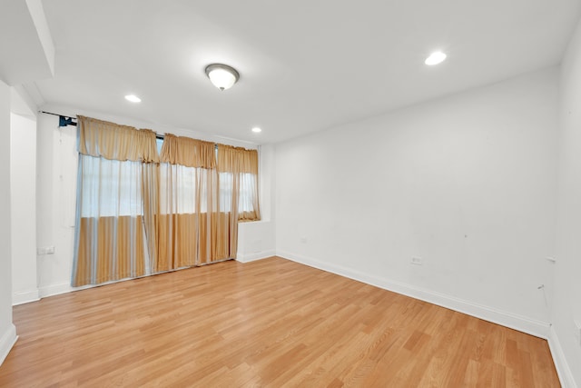 empty room with wood-type flooring