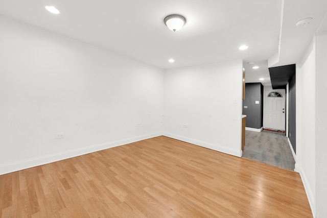 empty room with light hardwood / wood-style flooring