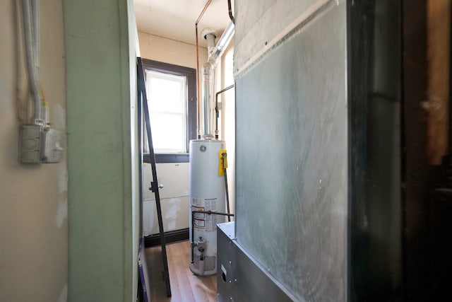 utility room featuring gas water heater